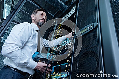 Handsome professional technician repairing the network server Stock Photo