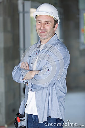 handsome repairman with arms crossed Stock Photo