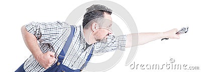 Handsome repairman with wrench in flying position acting like superman Stock Photo