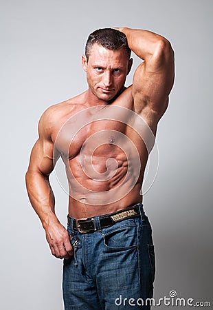 Handsome shirtless man - gray background Stock Photo