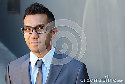 Handsome smiling confident ethnic businessman portrait with copy space on the right Stock Photo