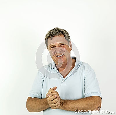 Handsome smiling man in blue leisure polo shirt Stock Photo