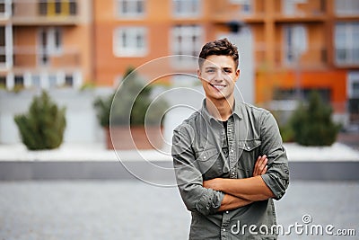 Handsome smiling young man portrait. Cheerful man looking at camera Stock Photo