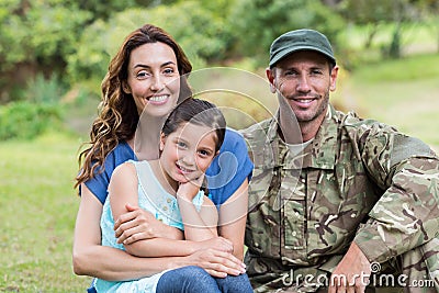 Handsome soldier reunited with family Stock Photo
