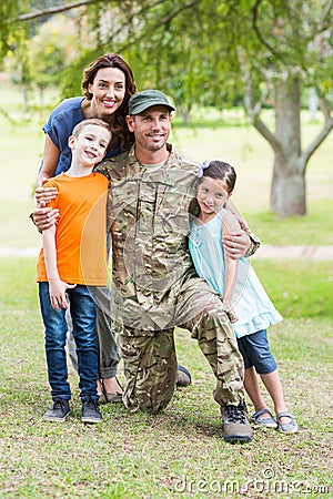 Handsome soldier reunited with family Stock Photo