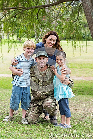 Handsome soldier reunited with family Stock Photo