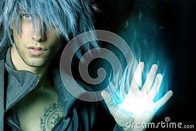 Handsome sorcerer that creates a blue fireball Stock Photo