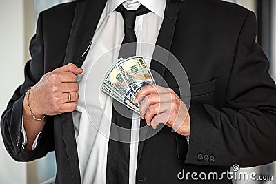 handsome stylish businessman in trade owns many thousands of dollars. Stock Photo