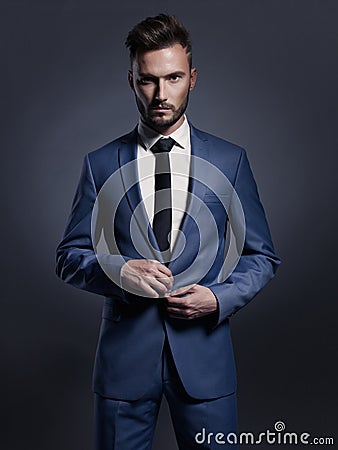 Handsome stylish man in blue suit Stock Photo