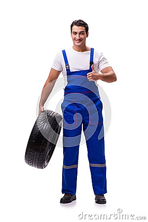 The handsome tyre repairman isolated on white Stock Photo