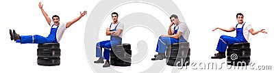 The handsome tyre repairman isolated on white Stock Photo