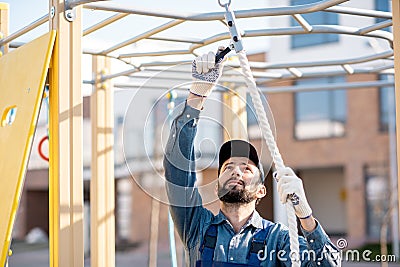Workman mounting playground Stock Photo