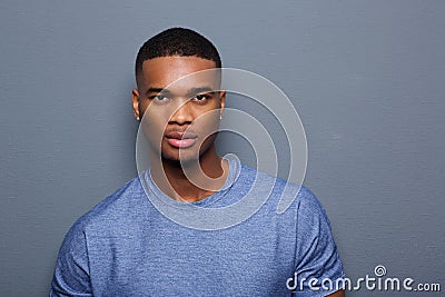 Handsome young black man with serious expression on face Stock Photo