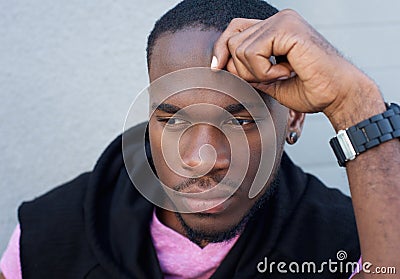 Handsome young black man thinking Stock Photo