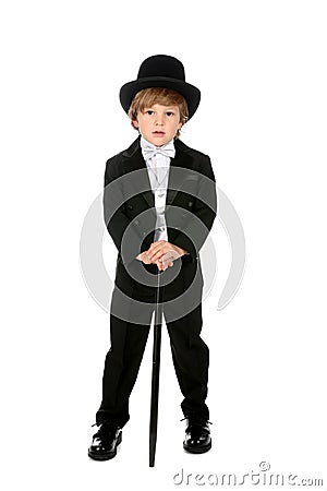 Handsome young boy in black tuxedo and tophat Stock Photo