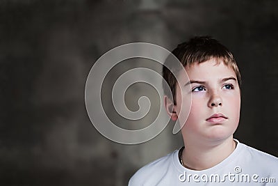 Handsome Young boy looking up with determination Stock Photo