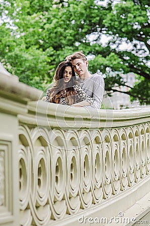 Romantic couple on Bow Bridge in Cetral Park Stock Photo