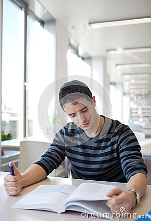 Handsome young college student in a library Stock Photo