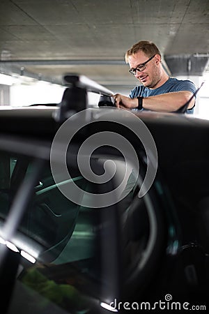 Handsome young driver getting ready to go biking Stock Photo