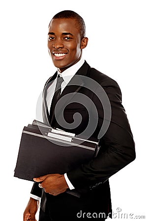 Handsome young executive holding files Stock Photo
