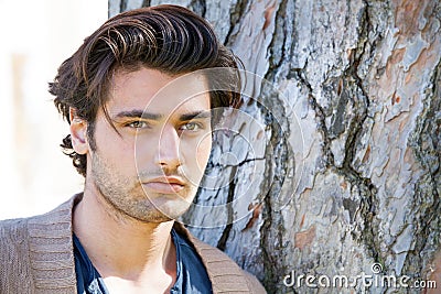 Handsome young italian man portrait, stylish hair. Male hairstyle Stock Photo