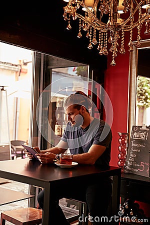 Handsome young lad in a bar Stock Photo