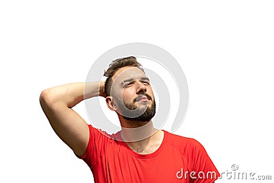 handsome young man looking up, smoothing hair isolated on white background. narcissism, sense of superiority Stock Photo