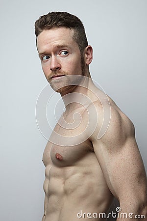 Handsome young man with perfect muscule body posing. Stock Photo