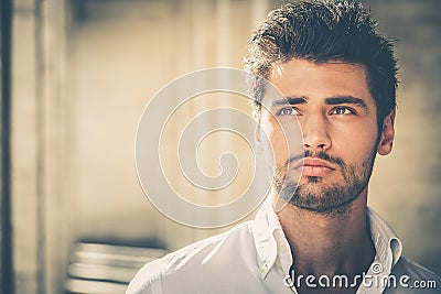 Handsome young man portrait. Intense look and eye-catching beauty Stock Photo