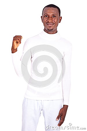 Handsome young man raising his fist Stock Photo