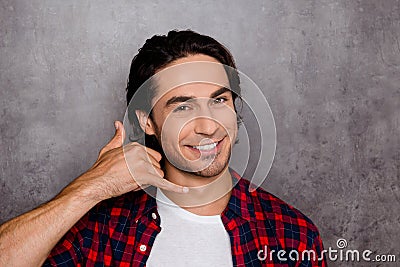 Handsome young man showing with fingers gesture `call me` Stock Photo