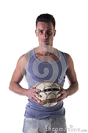 Handsome young man in tanktop holding soccer ball Stock Photo