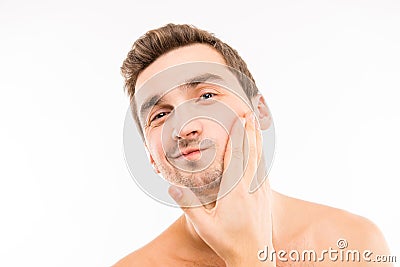 Handsome young man touching his face after shave Stock Photo