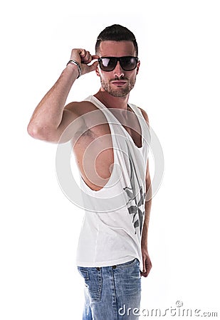 Handsome young man in white tanktop and sunglasses Stock Photo