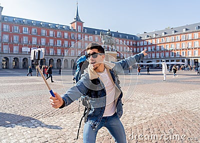 Handsome young student tourist man happy and excited taking a selfie in Madrid, Spain Stock Photo