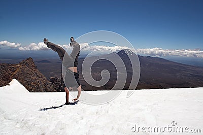 Handstand on snow at Mount Ruapehu Stock Photo