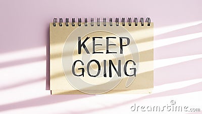 Handwriting Announcement text showing Keep Going. Business concept for Go Moving Forward Letting written on notebook Stock Photo