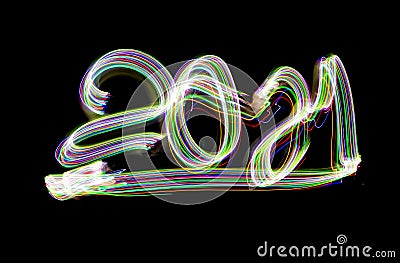 2021, handwriting with flashlight isolated on black background. Light painting. Long exposure photography Stock Photo