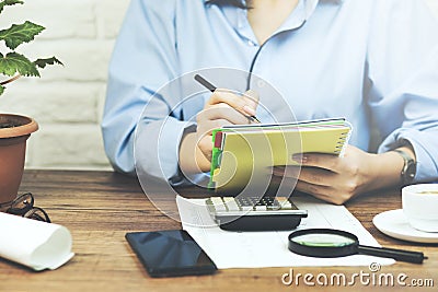 Handwriting, hand writes with a pen in a notebook Stock Photo