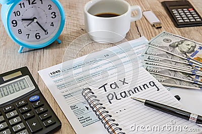 Handwriting of Tax Planning as memo on working table.Time for taxes. Money. Financial accounting concept. Taxation. Stock Photo