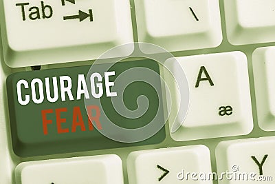 Handwriting text Courage Fear. Concept meaning quality of mind that enables a demonstrating to face difficulty White pc Stock Photo