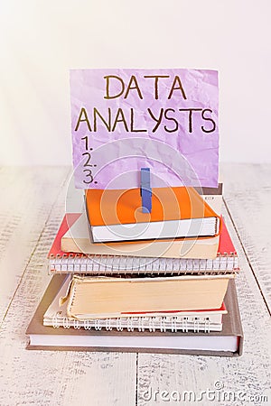Handwriting text Data Analysts. Concept meaning Programmer Design and Create Report Identifies patterns pile stacked books Stock Photo