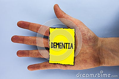 Handwriting text Dementia. Concept meaning Long term memory loss sign and symptoms made me retire sooner written on Yellow Sticky Stock Photo