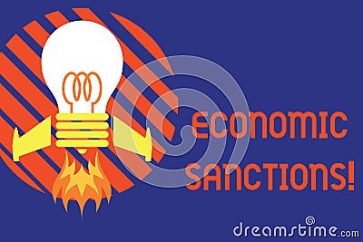 Handwriting text Economic Sanctions. Concept meaning Penalty Punishment levied on another country Trade war Top view Stock Photo