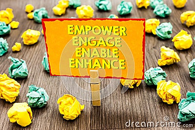 Handwriting text Empower Engage Enable Enhance. Concept meaning Empowerment Leadership Motivation Engagement Paperclip hold writte Stock Photo