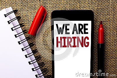 Handwriting text We Are Hiring. Concept meaning Talent Hunting Job Position Wanted Workforce HR Recruitment written on Mobile Phon Stock Photo