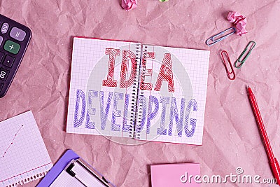 Handwriting text Idea Developing. Concept meaning innovating the concept and bringing the idea to reality Papercraft craft paper Stock Photo