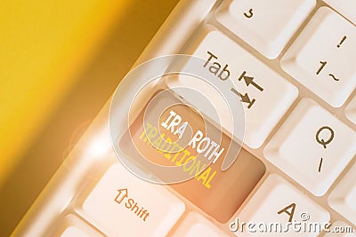 Handwriting text Ira Roth Traditional. Concept meaning are tax deductible on both state and federal White pc keyboard with empty Stock Photo