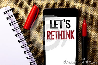 Handwriting text Let Us Rethink. Concept meaning Give people time to think things again Remodel Redesign written on Mobile Phone o Stock Photo