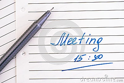 Handwriting text Meeting 15 30 on lined paper with pen Stock Photo